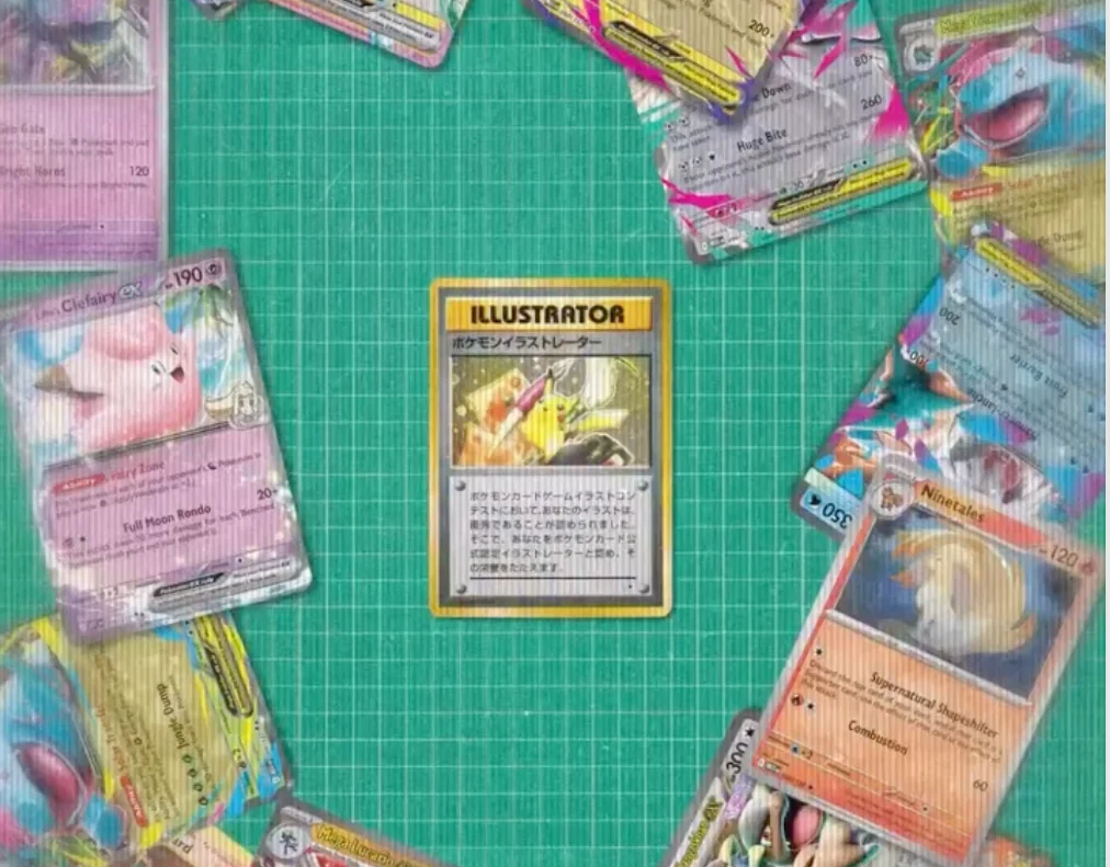An Illustrator Pokémon card surrounded by trading cards on a green cutting mat.